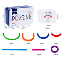 Iron puzzle box 13.5 by 9 by 4.8 cm, a cat card of 5.5 cm and colored arcs, sticks and rings with piece counts
