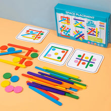 Space Placement box with pattern cards, sticks and discs scattered on an orange table