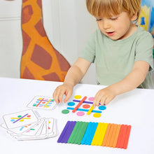 Young boy at a table laying rainbow sticks and discs to copy a pattern card