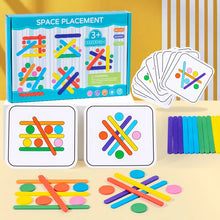 Space Placement box with pattern cards, rainbow sticks and colorful discs on a yellow table