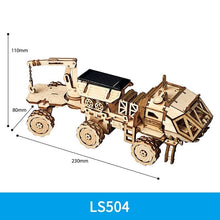 Wooden tractor gear model with dimension guide from the 3D puzzle kit for planning display space before building.