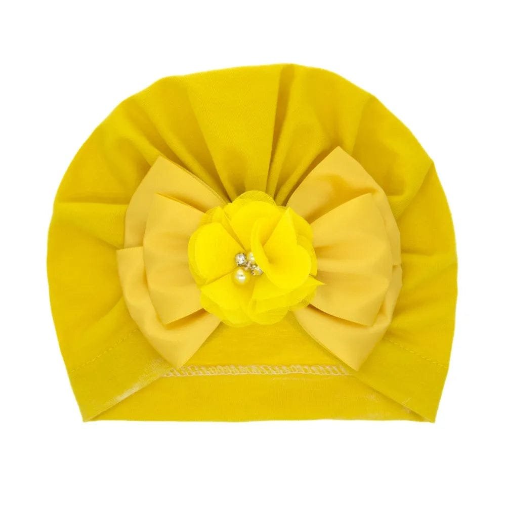 Shiny Rhinestone Bowknot Baby Turban in yellow with flower and pearl details for gifting.