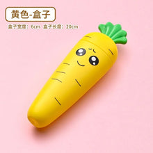 Yellow carrot-shaped baby tableware container with a green top shown from another angle.