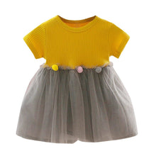 Yellow and grey patchwork tulle kids dress full length shot for birthdays, photos, and daily toddler wear.