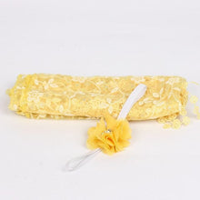 Yellow lace newborn wrap and flower prop set for bright, cheerful baby photography and keepsake shots.