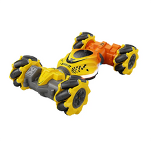 Motion-controlled drift RC car with twist and climb ability in yellow, black, and orange colorway.