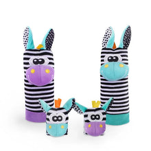 Zebra-themed baby rattle and foot finder socks set as a newborn sensory toy for cot time and playmat sessions.
